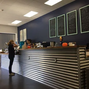 a woman standing at the counter