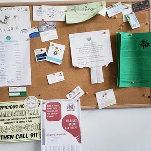 a cork board with many items on it