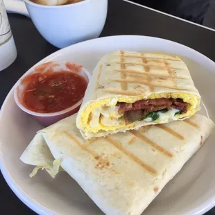 Bacon, swiss, egg and spinach breakfast burrito