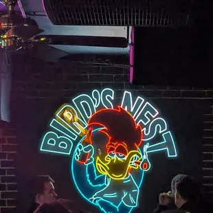 a neon sign for a bar