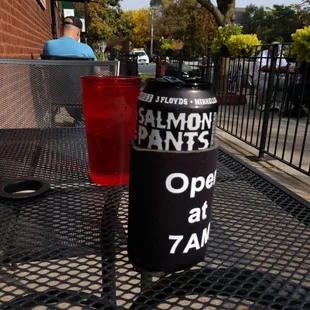 a drink and a can on a table