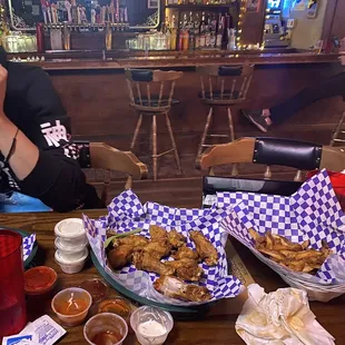 Plain wings, Cajun fries,  3 blue cheese, 1 ranch, 2 hot sauce, 1 honey bbq