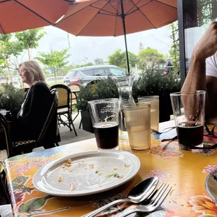 a man sitting at a table with a plate of food