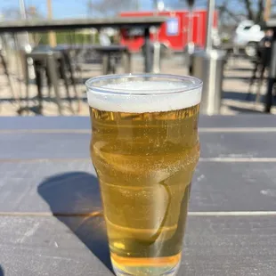 a glass of beer on a table