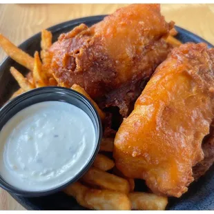 a plate of fried fish and french fries