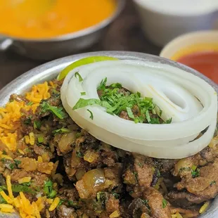 Lamb Biryani (front); Butter Chicken Masala (back).