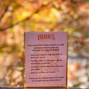 a menu on a window sill