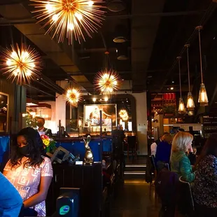 people sitting at tables and eating