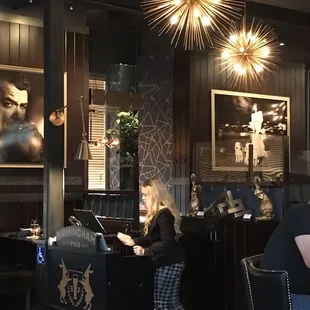 a woman sitting at a bar