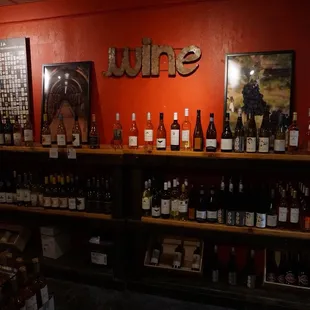 bottles of wine on shelves in a wine shop