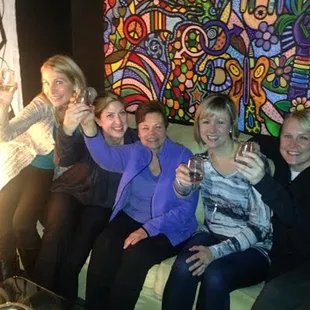 a group of women sitting on a couch