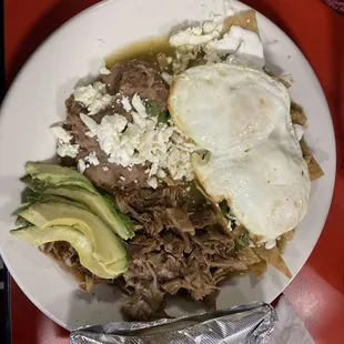 Chilaquiles plate with carnitas