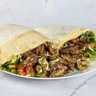 Shawarma, All our Shawarmas contain: Tomato, lettuce, coriander, chickpea cream "hummus", white garlic sauce