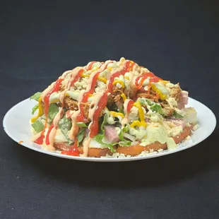 Flavorful Arepa Cabimera: 2 fried arepas, 2 eggs, chicken or fired pork or beef, cheese, veggies &amp; ham. A taste sensation!