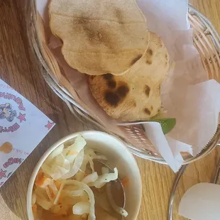 Toasted tortillas and marinated onions as an appetizer.