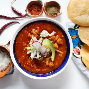 a bowl of chili and tortillas