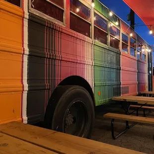 a colorful bus parked in a parking lot