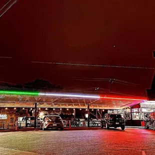 cars parked in front of a restaurant