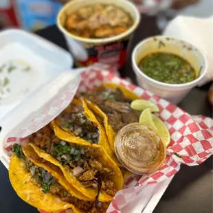 a plate of tacos and a bowl of salsa