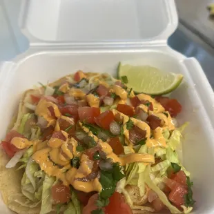 Shrimp taco. Grilled shrimp topped with lettuce, pico and chipotle sauce