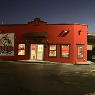 a red building at night