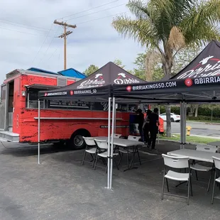 The truck with the outdoor dining.