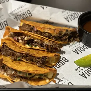 Birria tacos with consumme