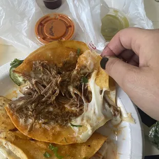 Salsa and sauce that comes with it and AMAZING tender meat melty cheese in quesabirria