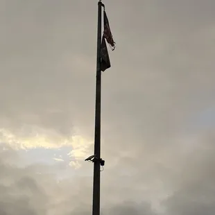 an american flag on a pole