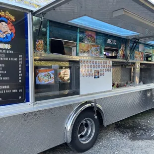 a food truck with a menu on the side