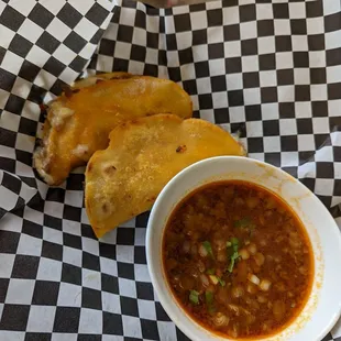 Birria tacos with consomé
