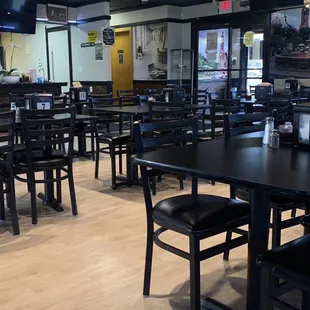 a restaurant with tables and chairs