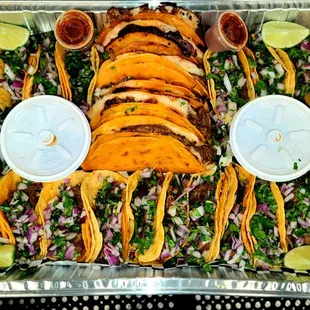  platter of tacos and lime wedges