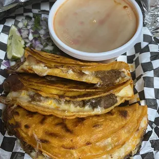 Quesobirria tacos and consome