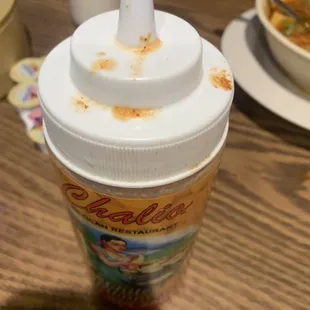 Dirty, crusty salsa containers. The carpet is just as filthy and crusty.