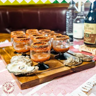 a tray of oysters and a bottle of beer