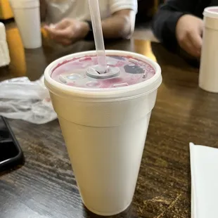 a drink in a plastic cup