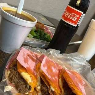 3 Quezabirria tacos, consume and a bottle of coca-cola