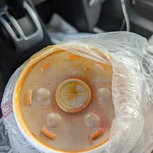 Why use a soda lid for the consome? Of course, it spilled inside the bag.