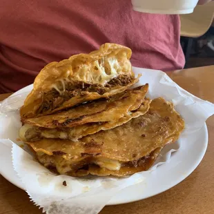 Birrieria tacos. Meat and cheese, great tasting meat and very good cheese, deep fried.