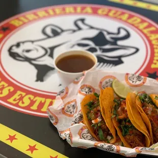 a plate of tacos and a cup of coffee