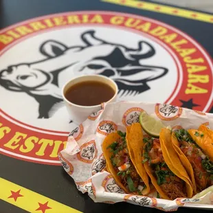 a plate of tacos and a cup of coffee