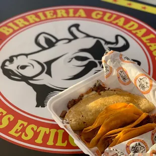 a sandwich in a paper container