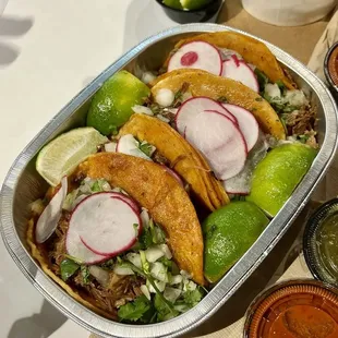 Shredded beef and goat tacos