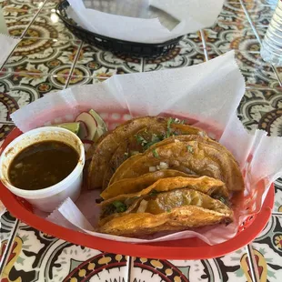 Quesabirria tacos with consume.