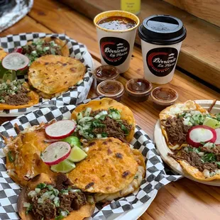 Beautiful spread! Plato la Plaza comes with a cup of delicious consume. 2 quesotacos and vampiro.