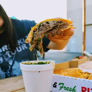 a woman eating a burrito