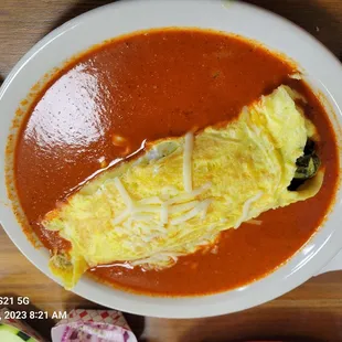 Chile relleno omelette. SPICY RED SAUCE