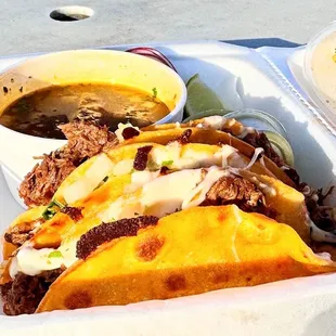  bowl of soup and a sandwich