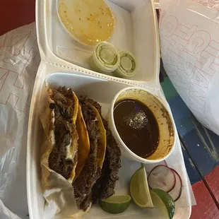 Plate of birria tacos